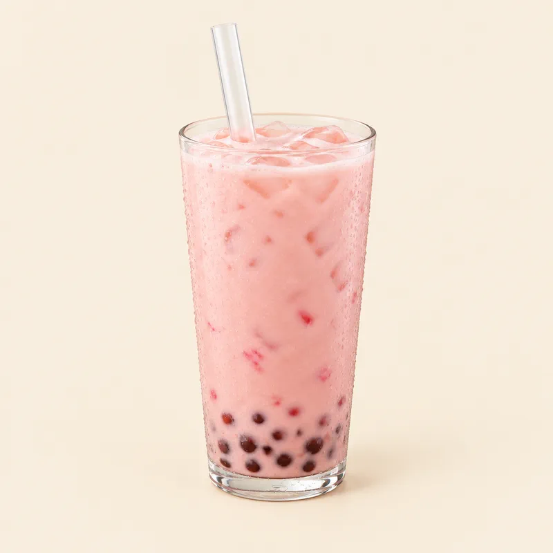 Strawberry milk tea with tapioca boba pearls in a clear cup