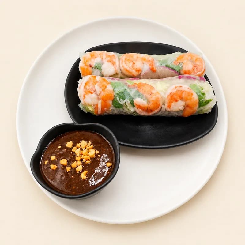 Fresh rice-paper spring rolls with shrimp and herbs and peanut dipping sauce